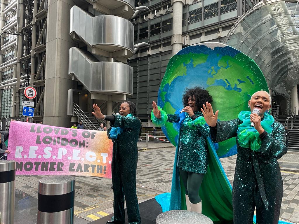 Mother Earth performs outside Lloyd’s of London in Mother’s Day plea for climate action